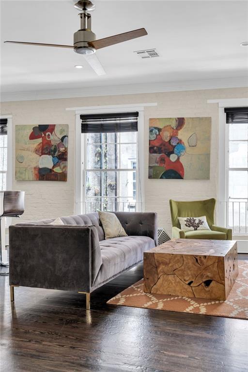 220 Decatur St Unit 304, New Orleans, LA 70130 - living room with crown molding, wood finished floors, and a ceiling fan