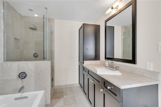 220 Decatur St Unit 304, New Orleans, LA 70130 - full bathroom featuring vanity, a garden tub, and a stall shower