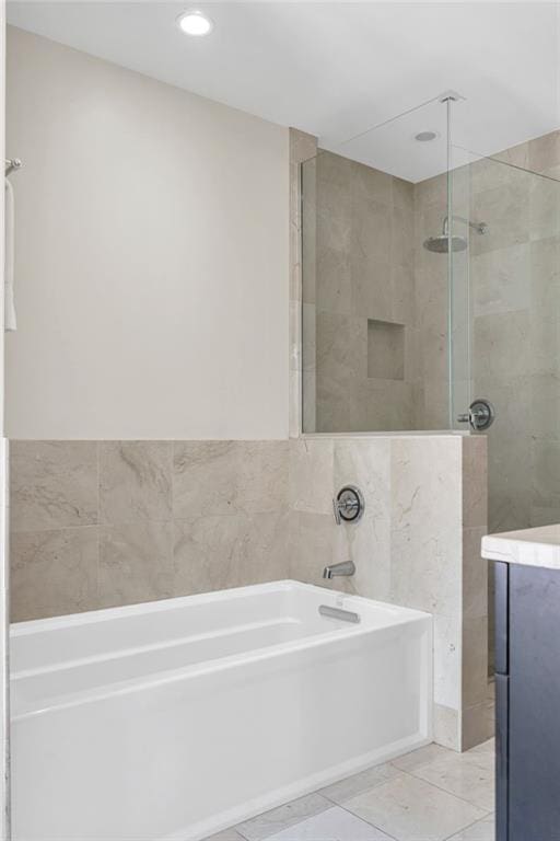 220 Decatur St Unit 304, New Orleans, LA 70130 - bathroom featuring a bath, a stall shower, vanity, and recessed lighting