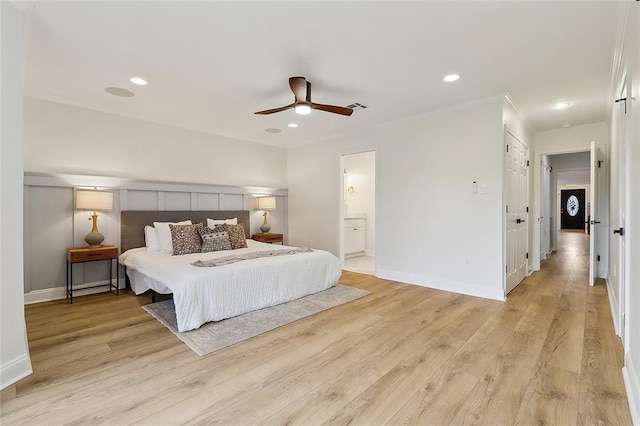 4721 Chastant St, Metairie, LA 70006 - bedroom with ornamental molding, baseboards, light wood-type flooring, recessed lighting, and connected bathroom