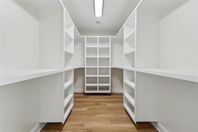 4721 Chastant St, Metairie, LA 70006 - spacious closet featuring wood finished floors