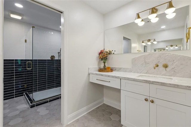4721 Chastant St, Metairie, LA 70006 - full bathroom featuring tile patterned floors, vanity, a shower stall, and baseboards