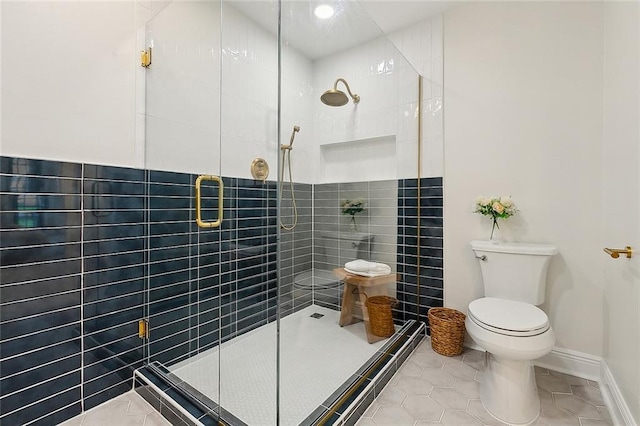 4721 Chastant St, Metairie, LA 70006 - bathroom featuring a stall shower, toilet, and tile patterned flooring
