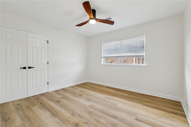 4721 Chastant St, Metairie, LA 70006 - unfurnished bedroom with a closet, light wood-style floors, and baseboards