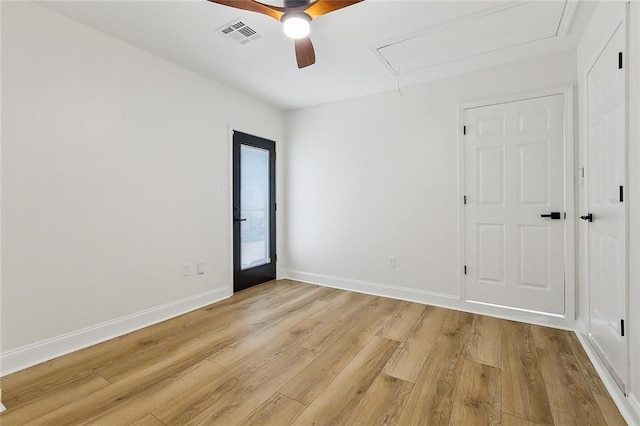 4721 Chastant St, Metairie, LA 70006 - spare room with attic access, light wood-style flooring, ceiling fan, and baseboards