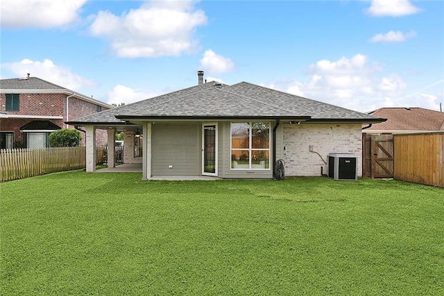 4721 Chastant St, Metairie, LA 70006 - back of property featuring central air condition unit, a shingled roof, a gate, a patio area, and brick siding