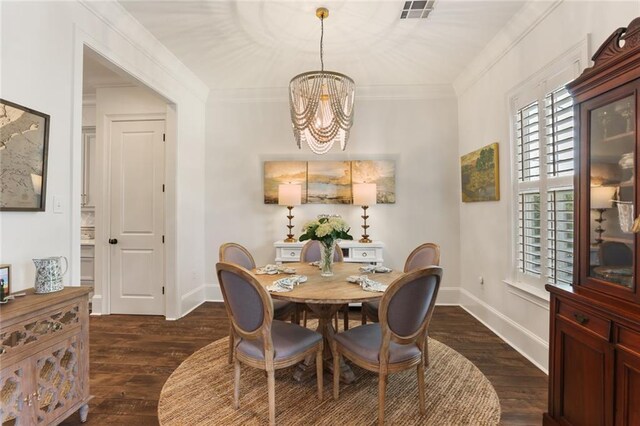 247 26th St, New Orleans, LA 70124 - dining room featuring a chandelier, dark wood-style flooring, baseboards, and ornamental molding