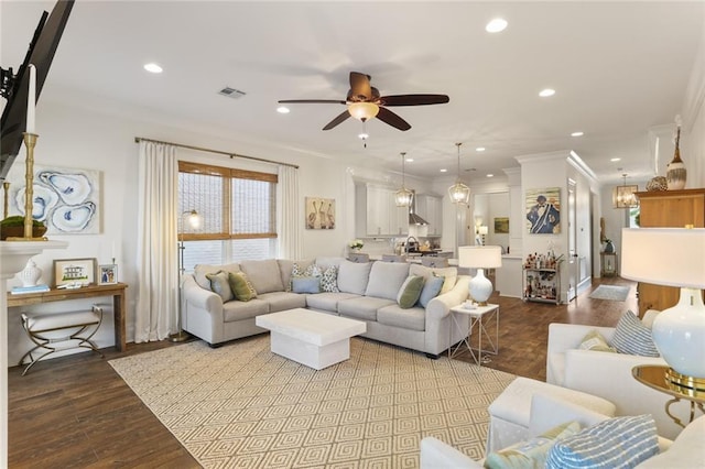 247 26th St, New Orleans, LA 70124 - living area featuring ornamental molding, a ceiling fan, recessed lighting, and wood finished floors