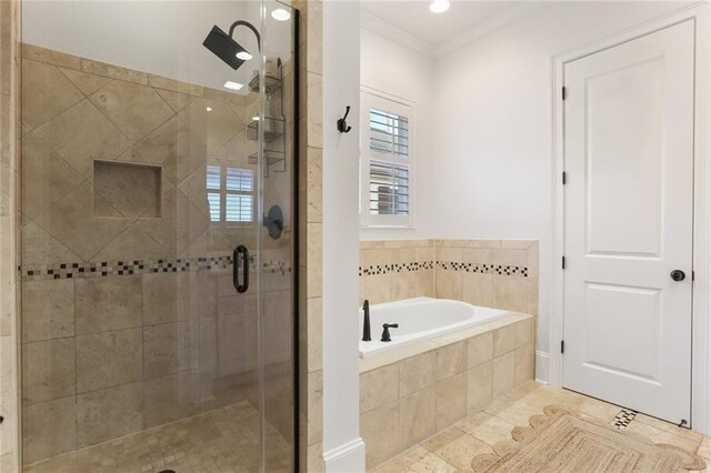 247 26th St, New Orleans, LA 70124 - full bathroom featuring a bath, a shower stall, crown molding, and tile patterned floors