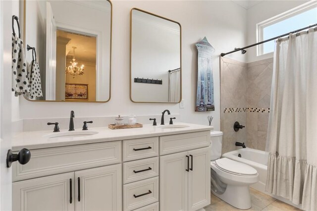 247 26th St, New Orleans, LA 70124 - bathroom with double vanity, toilet, shower / tub combo with curtain, and a chandelier