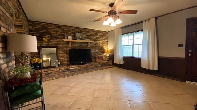 10311 Gatlin Rd, Hammond, LA 70403 - unfurnished living room with ceiling fan, a fireplace, brick wall, and tile patterned floors