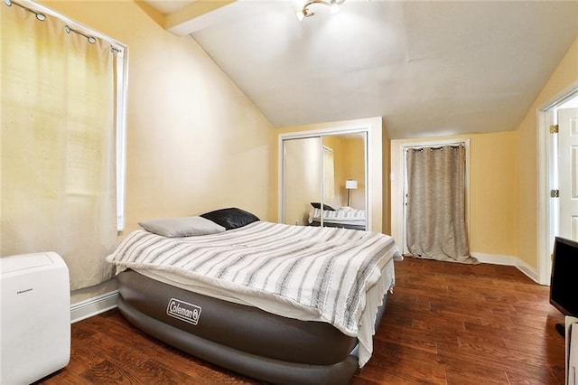 1509 N Derbigny St, New Orleans, LA 70116 - bedroom with vaulted ceiling, wood finished floors, and baseboards