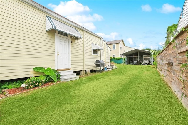 1509 N Derbigny St, New Orleans, LA 70116 - view of yard featuring a detached carport and entry steps