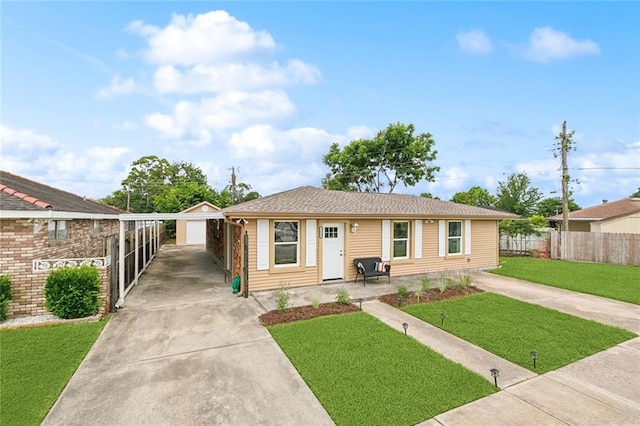 7504 Birch St, Violet, LA 70092 - view of front of home featuring concrete driveway, a carport, and an outdoor structure