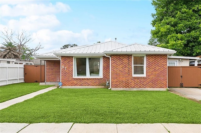 67 Cochrane Dr, Chalmette, LA 70043 - view of front of home featuring metal roof and brick siding