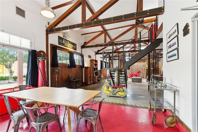 3300 Dumaine St, New Orleans, LA 70119 - dining area featuring high vaulted ceiling and concrete flooring