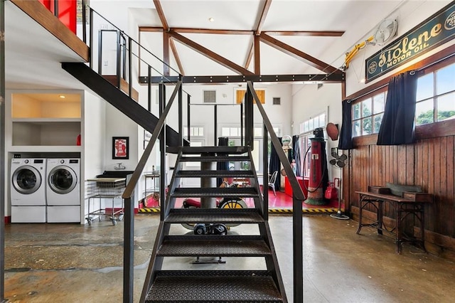 3300 Dumaine St, New Orleans, LA 70119 - staircase with independent washer and dryer, concrete flooring, and a high ceiling