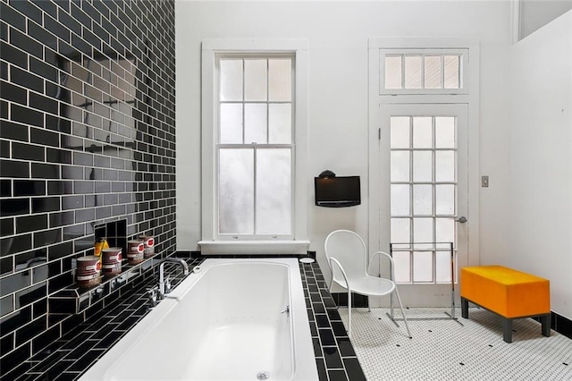 3300 Dumaine St, New Orleans, LA 70119 - bathroom with a garden tub, healthy amount of natural light, and baseboards