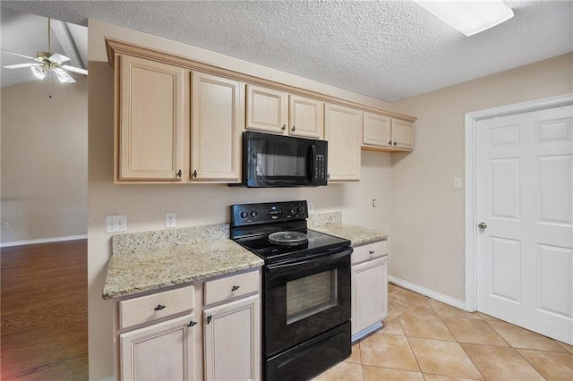 374 E Suncrest Loop, Slidell, LA 70458 - kitchen with black appliances, ceiling fan, baseboards, a textured ceiling, and light stone countertops