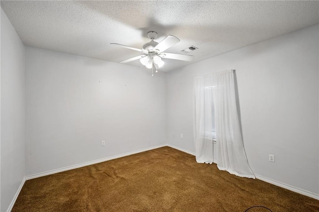 374 E Suncrest Loop, Slidell, LA 70458 - spare room featuring dark carpet, a ceiling fan, baseboards, and a textured ceiling