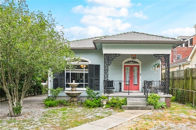 1500 Camp St, New Orleans, LA 70130 - view of front of home with a porch and a shingled roof