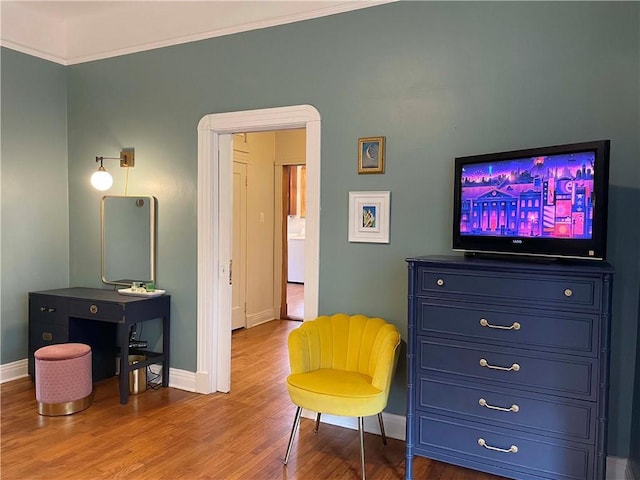 1500 Camp St, New Orleans, LA 70130 - sitting room featuring baseboards, wood finished floors, and crown molding