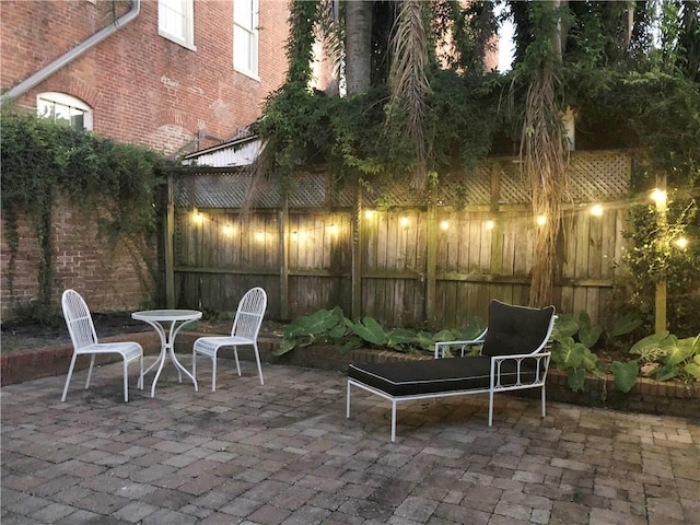 1500 Camp St, New Orleans, LA 70130 - fenced backyard with a patio area