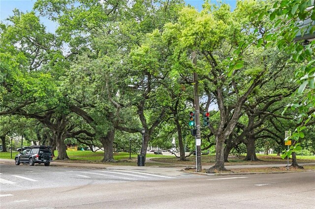 1500 Camp St, New Orleans, LA 70130 - view of asphalt street with curbs, sidewalks, traffic lights, and traffic signs