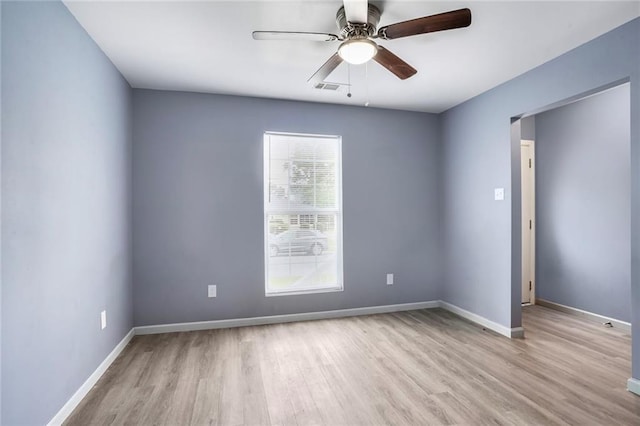 1319 Granada Dr, New Orleans, LA 70122 - unfurnished room with wood finished floors, ceiling fan, and baseboards
