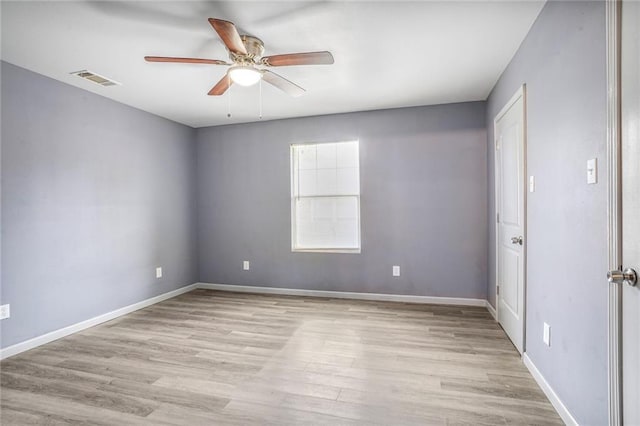 1319 Granada Dr, New Orleans, LA 70122 - spare room with ceiling fan, light wood-style floors, and baseboards