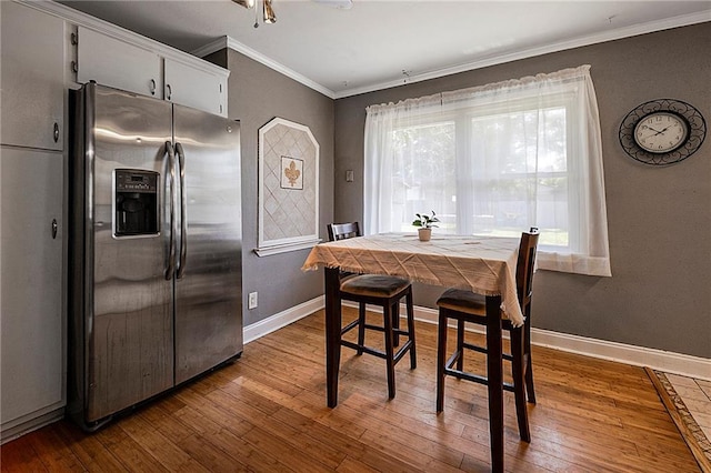 3620 Arizona Ave, Kenner, LA 70065 - dining area with crown molding, hardwood / wood-style floors, baseboards, and a ceiling fan