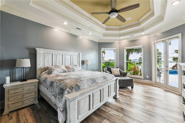 2097 S Lakeshore Blvd, Slidell, LA 70461 - bedroom featuring access to exterior, a raised ceiling, ornamental molding, wood finished floors, and recessed lighting