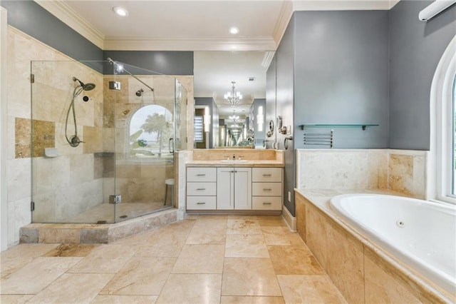 2097 S Lakeshore Blvd, Slidell, LA 70461 - bathroom featuring ornamental molding, a whirlpool tub, vanity, a stall shower, and a chandelier