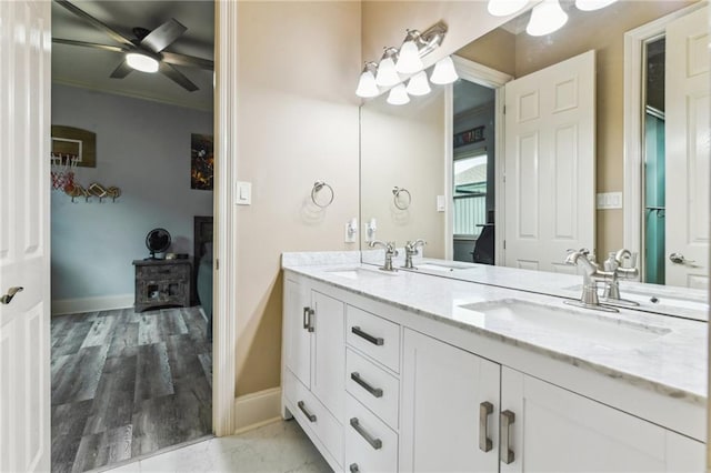 2097 S Lakeshore Blvd, Slidell, LA 70461 - full bathroom featuring double vanity, baseboards, a ceiling fan, and crown molding