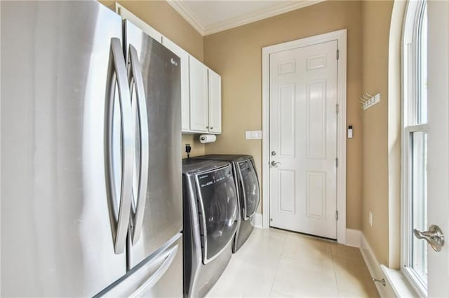 2097 S Lakeshore Blvd, Slidell, LA 70461 - laundry room with independent washer and dryer, cabinet space, crown molding, light tile patterned flooring, and baseboards