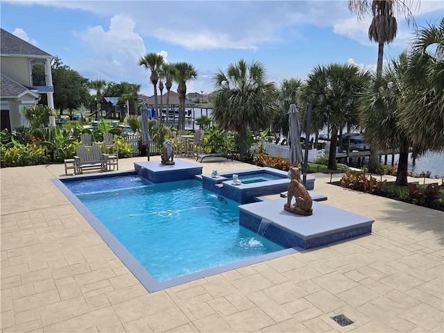 2097 S Lakeshore Blvd, Slidell, LA 70461 - view of swimming pool with a pool with connected hot tub and a patio area