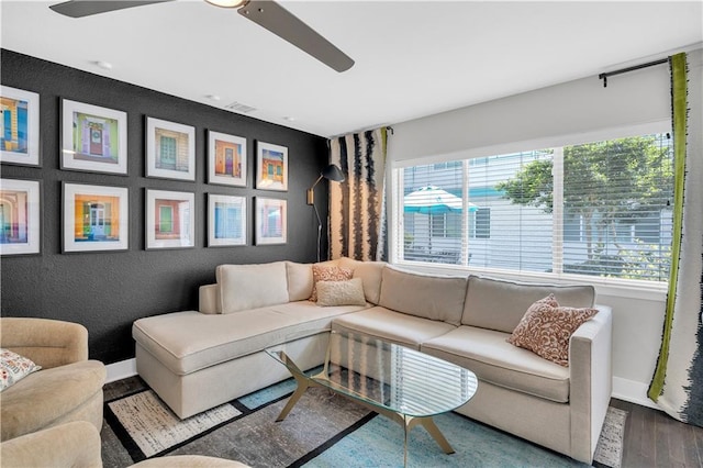 2833 St Charles Ave Unit 16, New Orleans, LA 70115 - living area with ceiling fan, plenty of natural light, baseboards, and wood finished floors