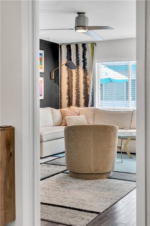 2833 St Charles Ave Unit 16, New Orleans, LA 70115 - living area with wood finished floors and ceiling fan