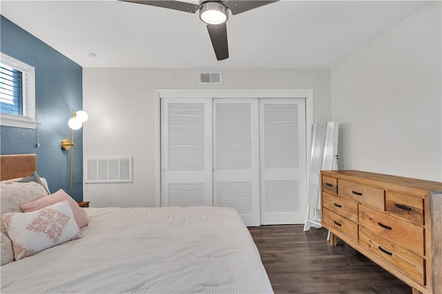2833 St Charles Ave Unit 16, New Orleans, LA 70115 - bedroom featuring dark wood-style flooring, a closet, and a ceiling fan