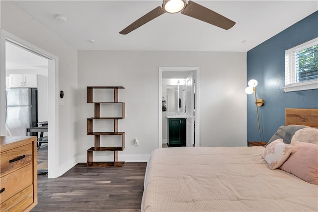 2833 St Charles Ave Unit 16, New Orleans, LA 70115 - bedroom featuring freestanding refrigerator, dark wood finished floors, baseboards, ensuite bath, and ceiling fan