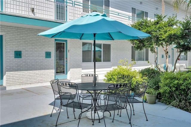 2833 St Charles Ave Unit 16, New Orleans, LA 70115 - view of patio / terrace with outdoor dining area and a balcony