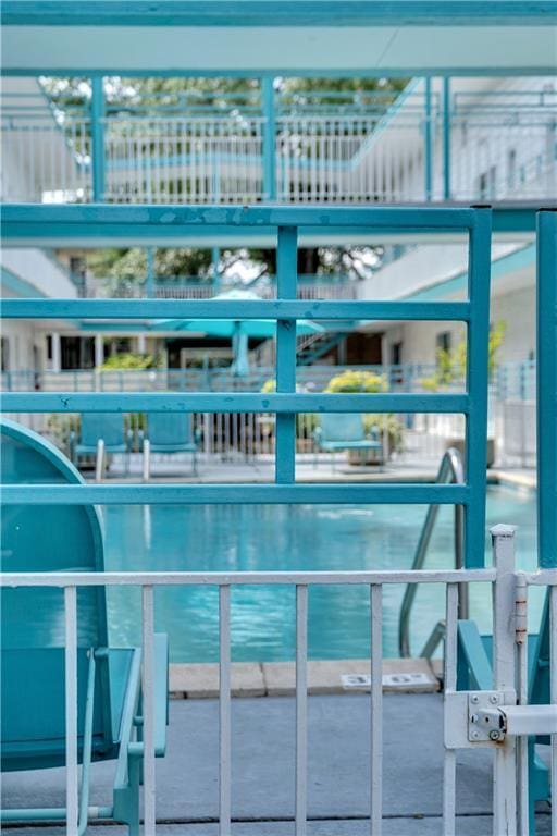 2833 St Charles Ave Unit 16, New Orleans, LA 70115 - view of pool with a water view and a gate
