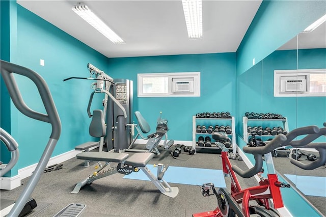 2833 St Charles Ave Unit 16, New Orleans, LA 70115 - workout area featuring a wall mounted AC and baseboards