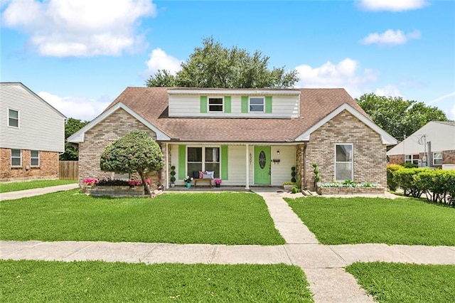 6301 Schouest St, Metairie, LA 70003 - traditional home featuring covered porch, a front yard, a shingled roof, and brick siding