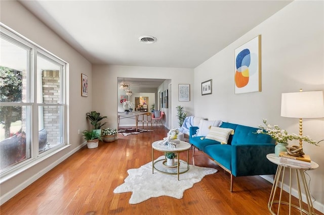 6301 Schouest St, Metairie, LA 70003 - living area featuring wood finished floors and baseboards