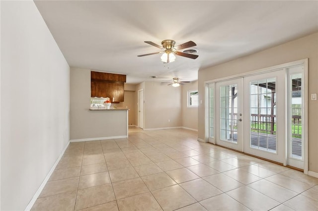 6301 Schouest St, Metairie, LA 70003 - unfurnished living room with light tile patterned flooring, french doors, a ceiling fan, and baseboards