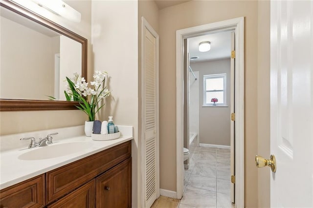 6301 Schouest St, Metairie, LA 70003 - bathroom with marble finish flooring, vanity, toilet, shower / tub combo with curtain, and baseboards