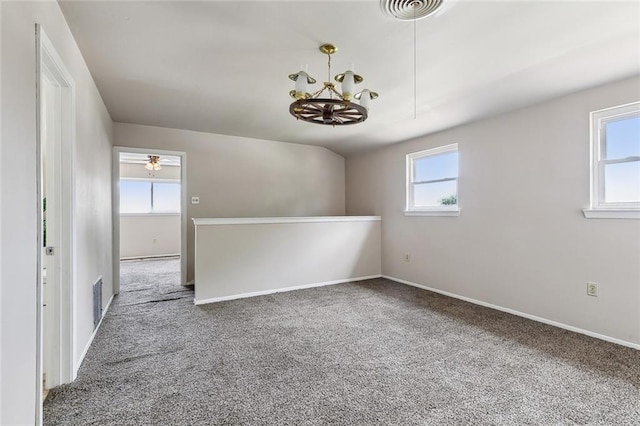 6301 Schouest St, Metairie, LA 70003 - carpeted spare room with a chandelier and baseboards