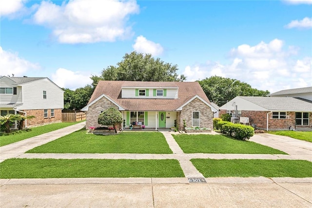 6301 Schouest St, Metairie, LA 70003 - traditional-style home with covered porch, stone siding, and driveway
