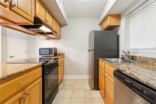 3805 Houma Blvd Unit A234, Metairie, LA 70006 - kitchen featuring stainless steel appliances, a sink, baseboards, under cabinet range hood, and light tile patterned floors